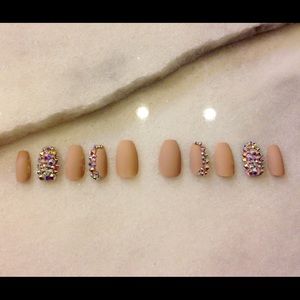 Matte nude and rhinestone nails